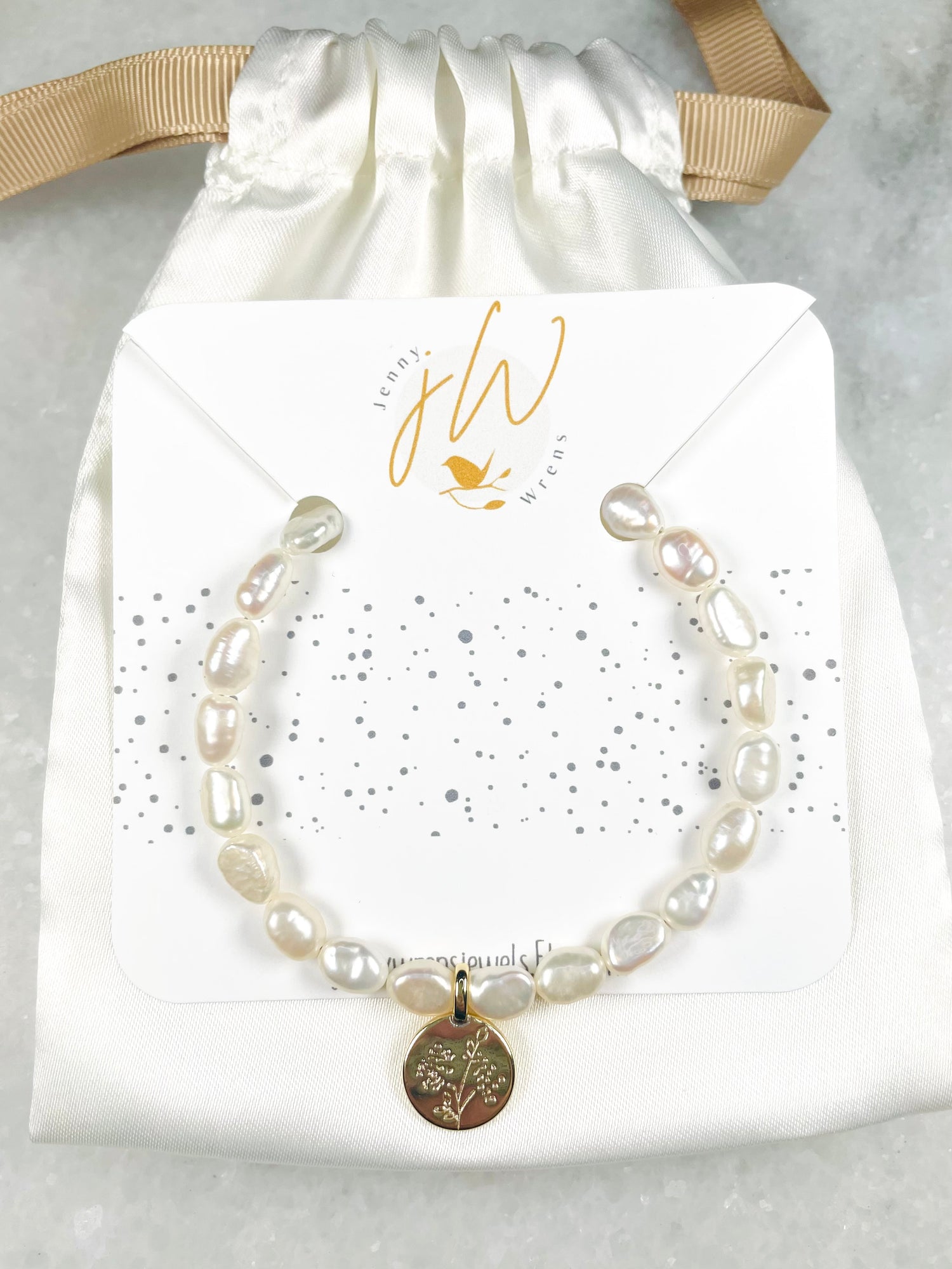 Medallion and freshwater pearl bracelet