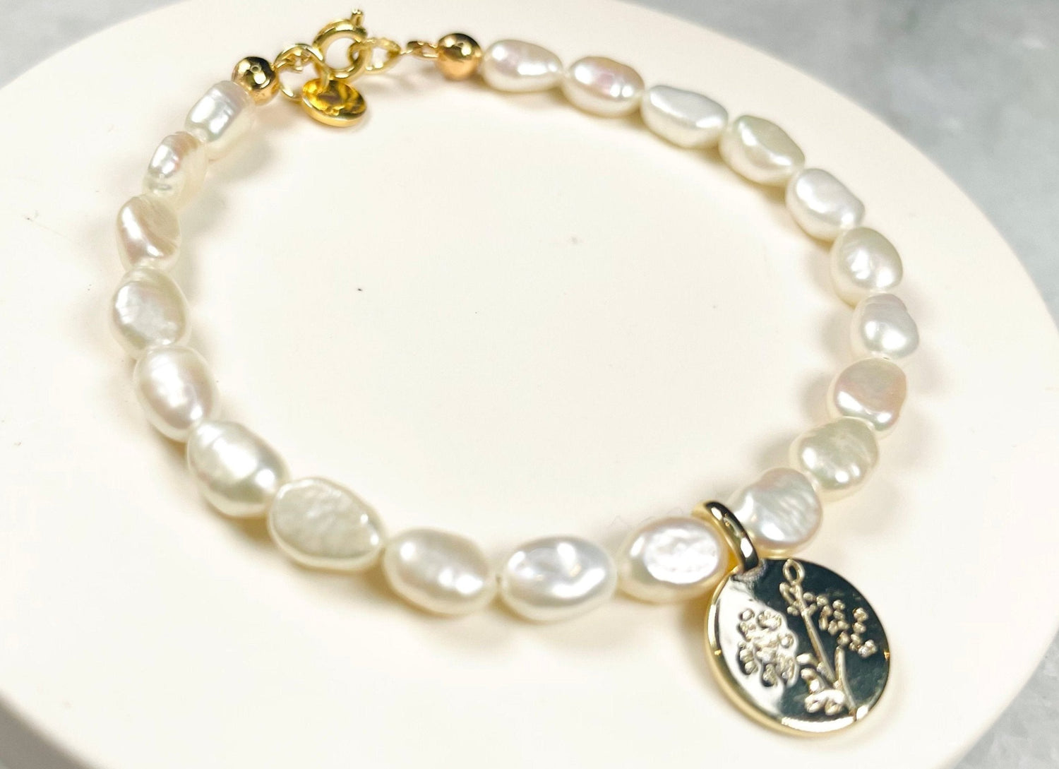 Medallion and freshwater pearl bracelet